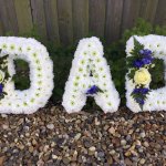 ###  Dad with foliage or ribbon edging and posies in other colours £90.00