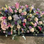 #### Luxury bright casket spray with roses lillies and other seasonal flowers
3ft £125    4ft £175    5ft £245