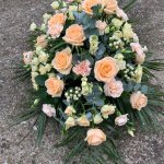 #### Peach and cream casket spray to include roses with seasonal flowers and foliage
 small 3ft  £110         medium 4ft  £165  ( as shown)        large 5ft £195