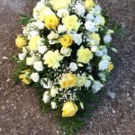 #### Casket spray in yellow and cream seasonal flowers to include carnations and roses 
small 3ft £105  medium 4ft £160 (as shown)  large 5ft £190