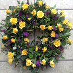 ###  Rose and spray rose wreath in yellow and purple with mixed foliage (other colours available)  
 16