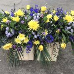 ####  Yellow and blue casket spray to include roses with seasonal flowers and foliage
  4ft £165      large 5ft £195 (as shown)