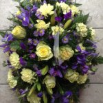 ####  yellow and purple casket spray to include roses and seasonal foliage     
 3ft £100 (as shown)   4ft £160   5ft £195  